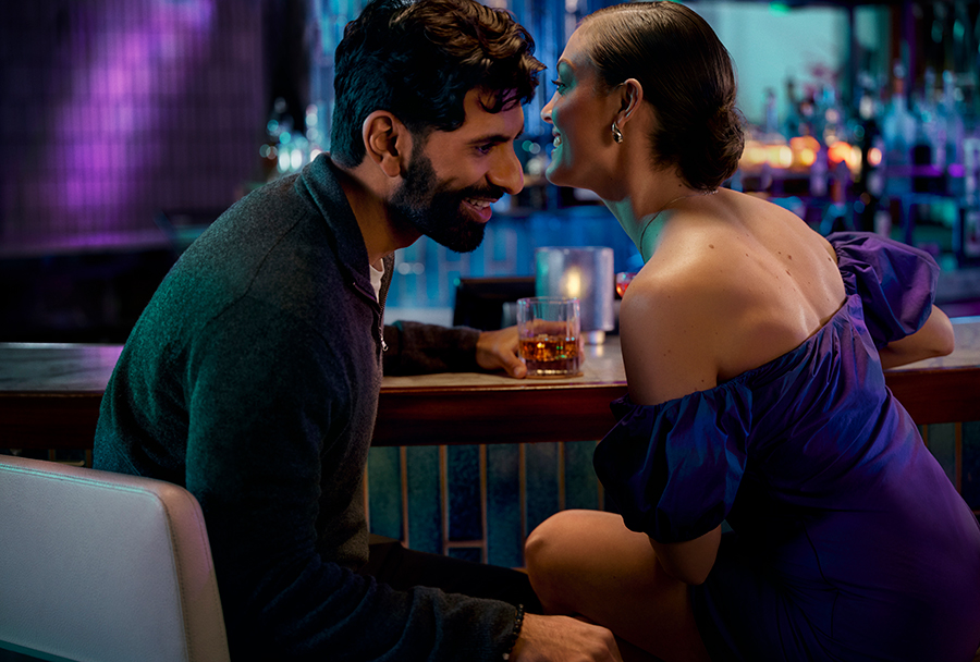 Couple talking at a bar