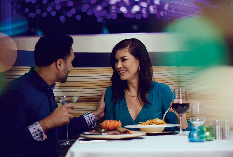 Couple dining & laughing