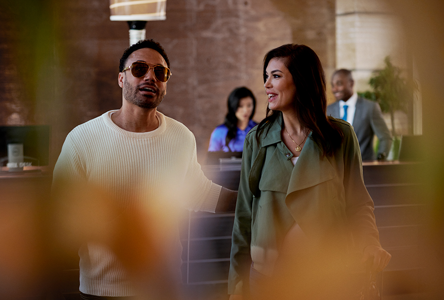 couple walking thru hotel lobby