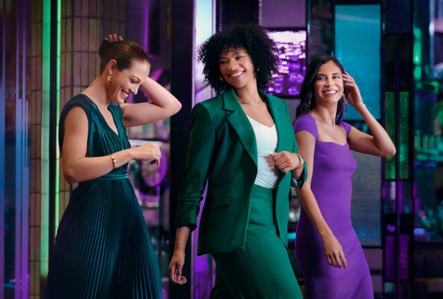 Group of women walking & laughing