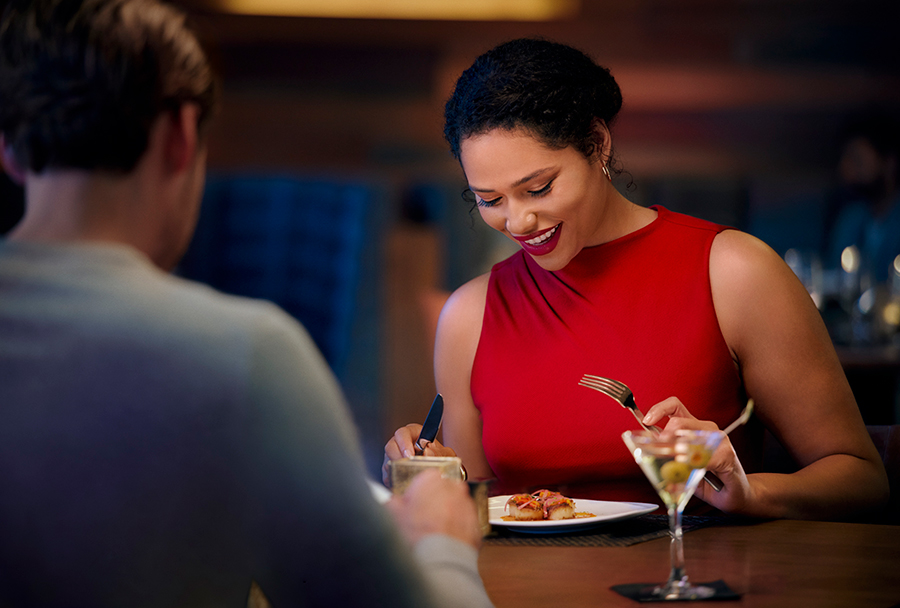 woman smiling and eating
