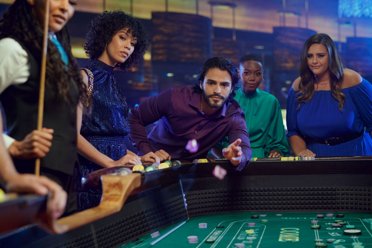 Man rolling dice at craps table
