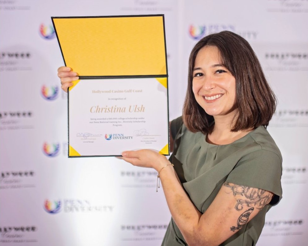 woman holding DEIB certificate