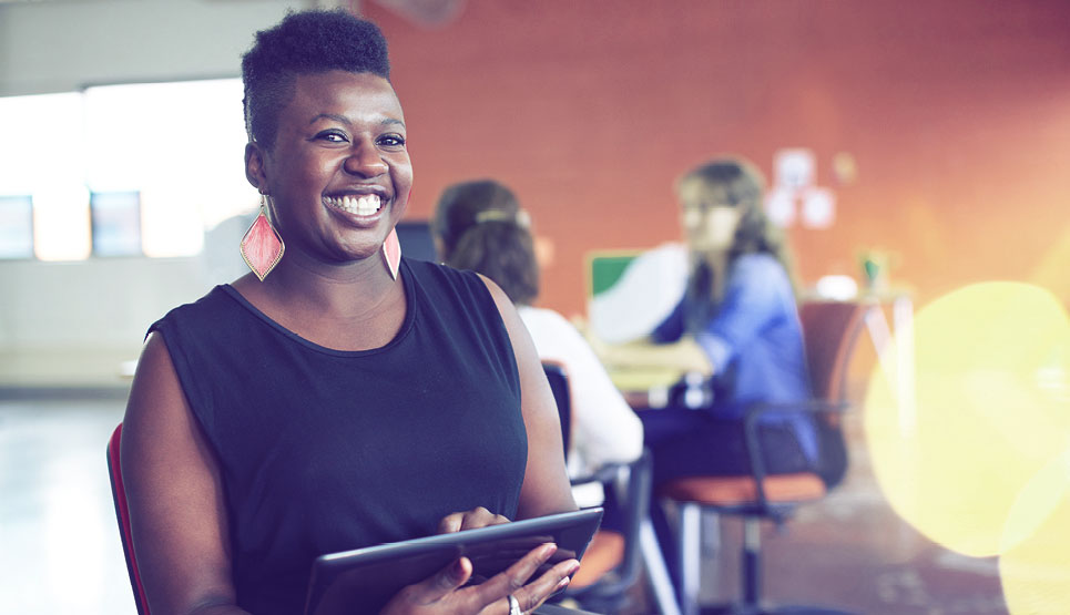 Smiling Woman with Tablet