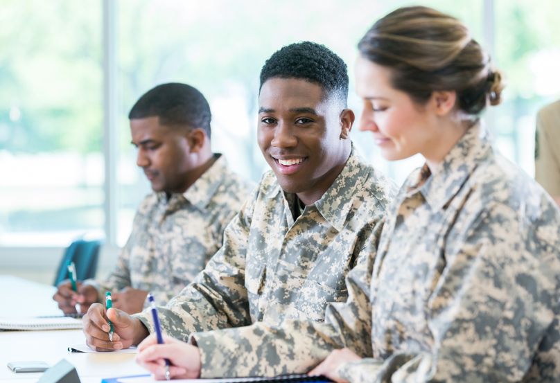 Military team members sitting at a table