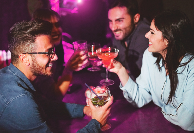 group of people sitting and drinking