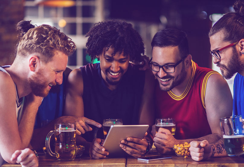 men on phone at bar