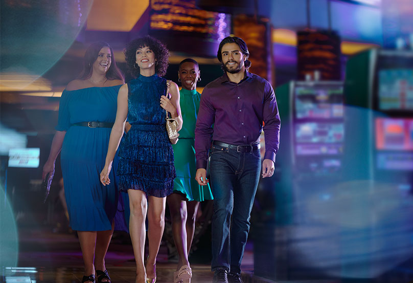 group of people walking in casino
