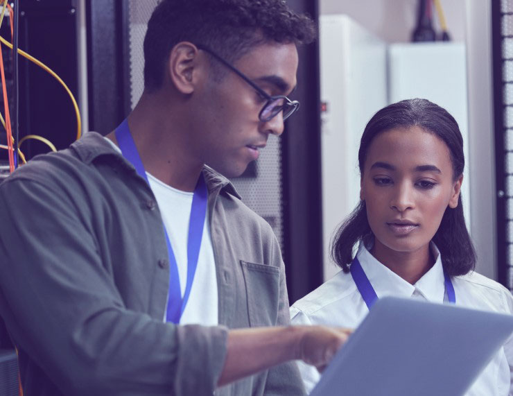 man showing a woman a computer